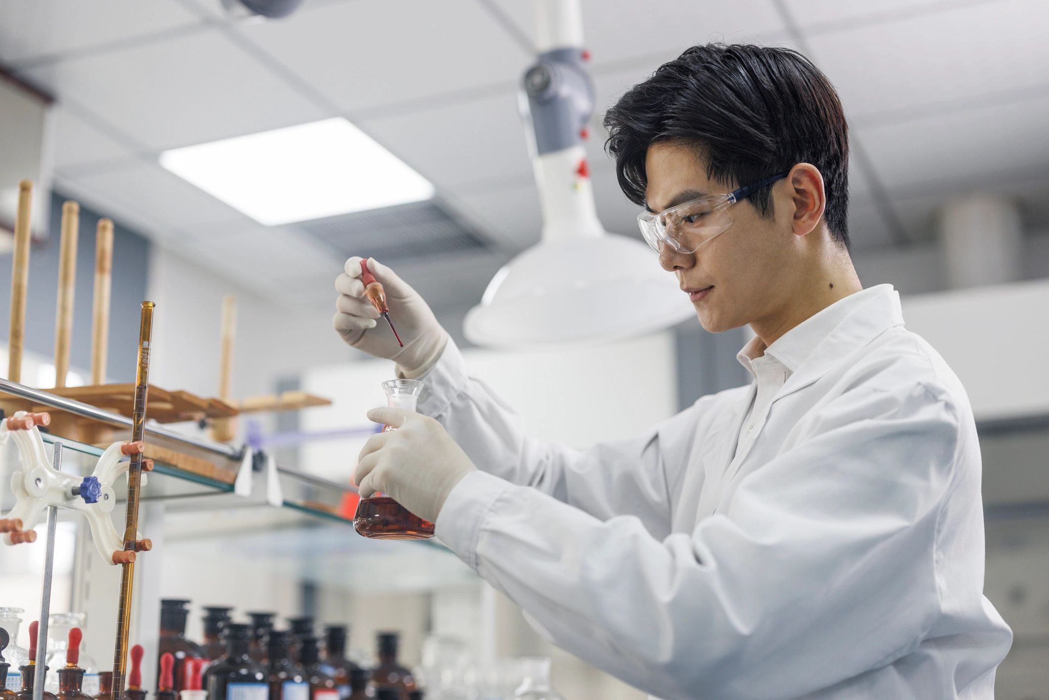 Scientist conducting botanical ingredient testing in a laboratory
