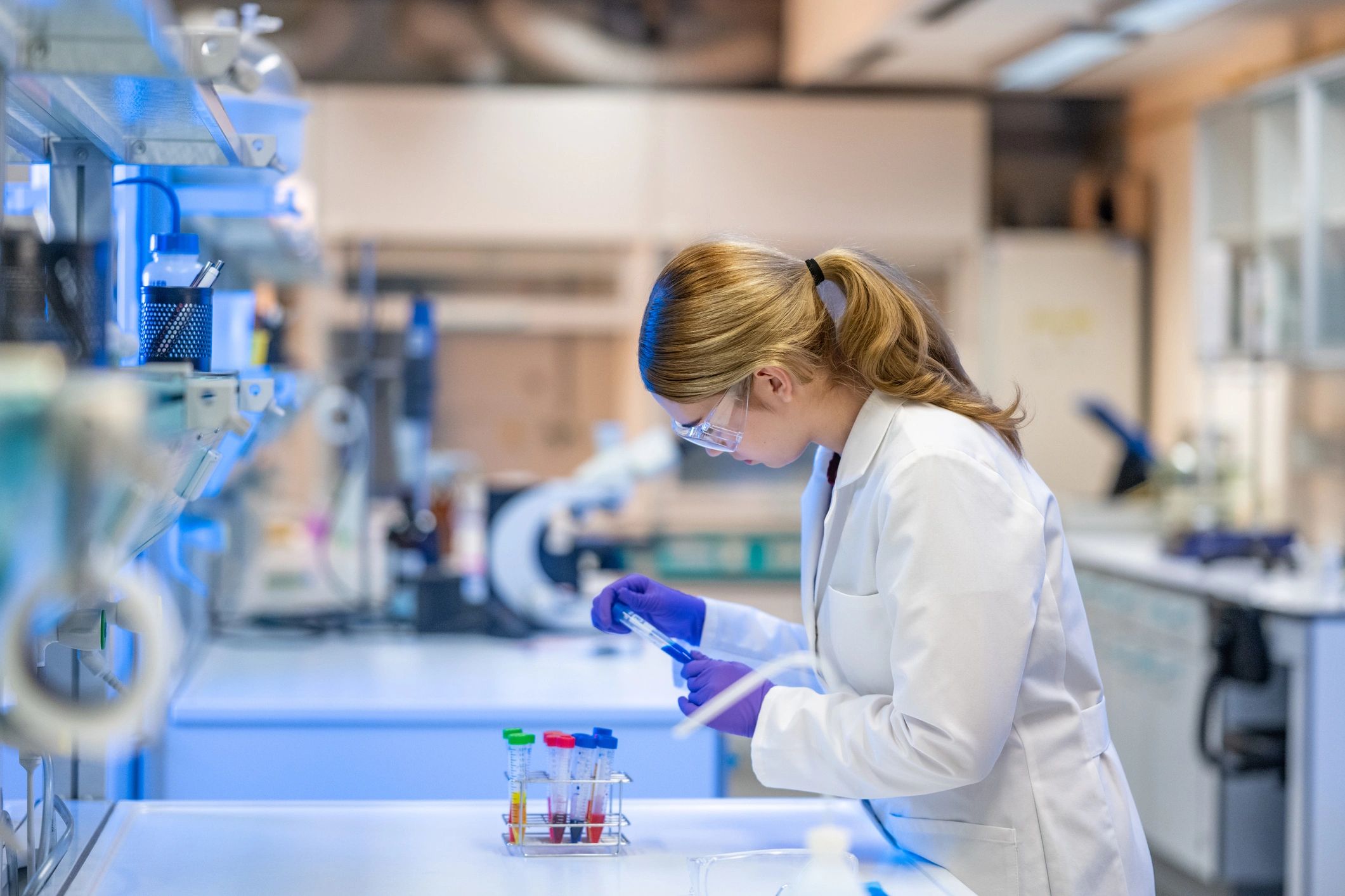 Scientist examining botanical samples in a laboratory